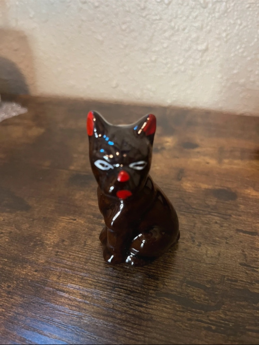 Hand-Painted Dark Brown Ceramic Cat Figurine with Red Accents